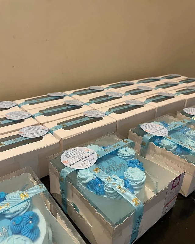 Premium cupcake box with 12 beautifully decorated cupcakes in blue wrappers and light blue frosting - Gift Cupcakes Karachi By Whisk And Sift
